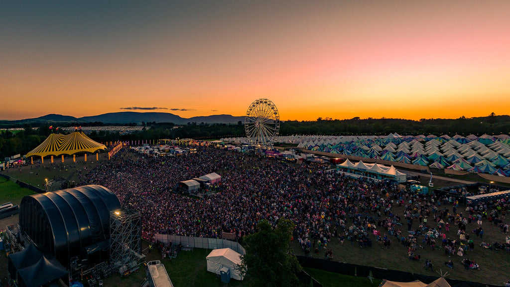 This is an image of the All Together Now Festival with a full crowd facing the center stage